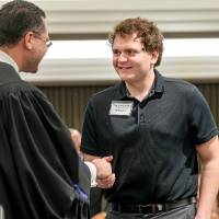 student shaking hands